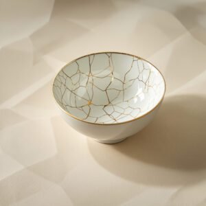 Bol en porcelaine fissuré réparé à l'or — symbolisant les produits numériques imparfaits qui conservent néanmoins leur valeur et leur beauté.
